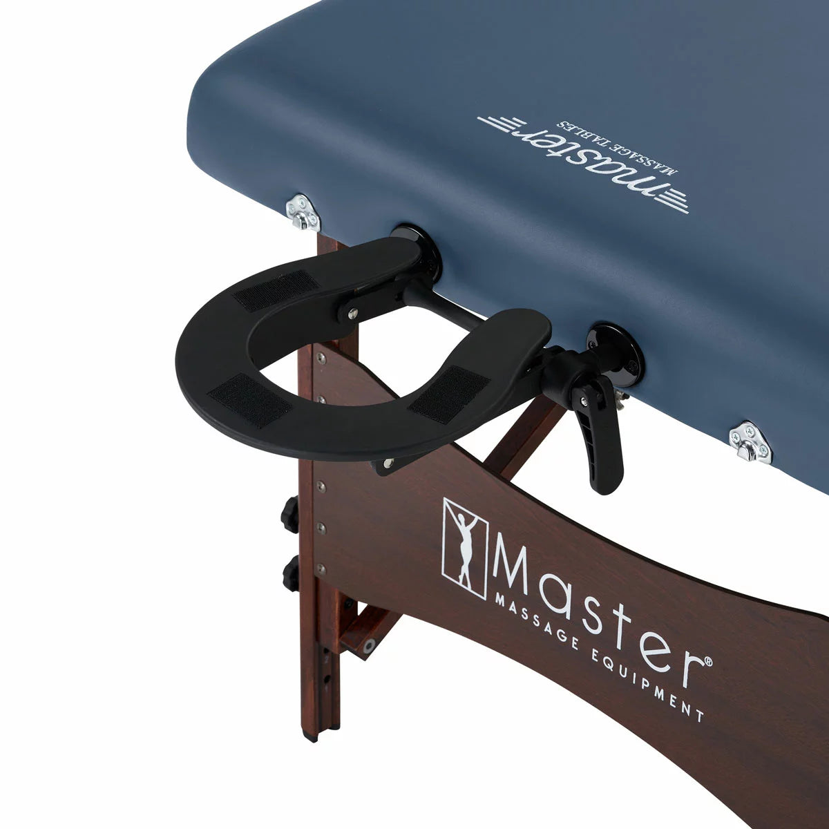 The Master Massage Roma II 76cm portable table in a neutral setting, displayed with its included armrest, bolster, and face cradle accessories.
