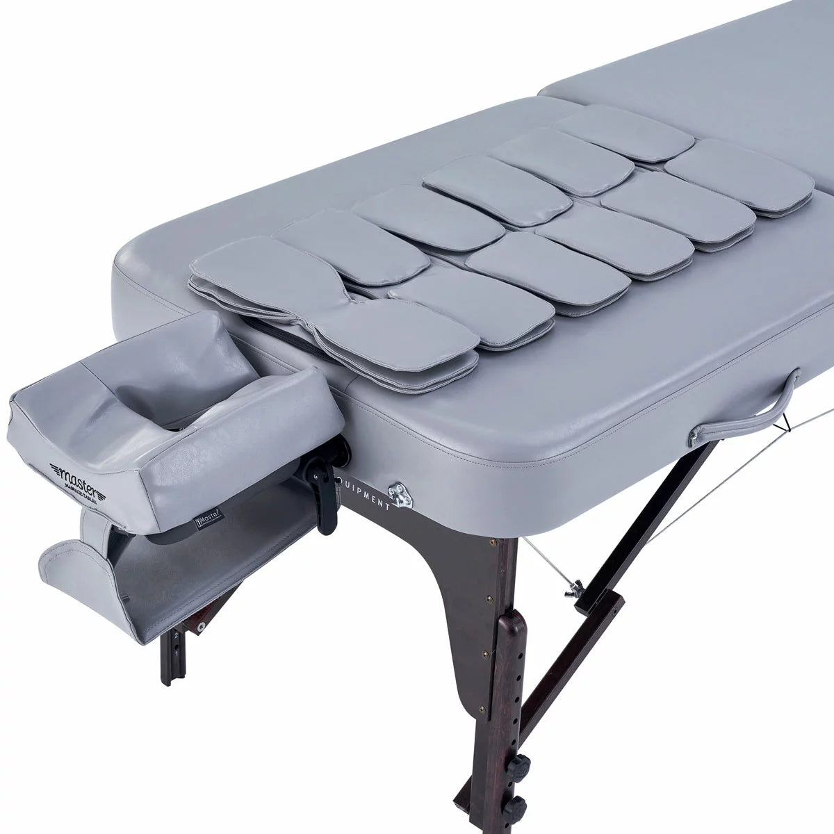 The Master Massage Bristol Airwave table set up in a clean, professional studio with visible airbag control panels and the included deluxe carry case positioned nearby.