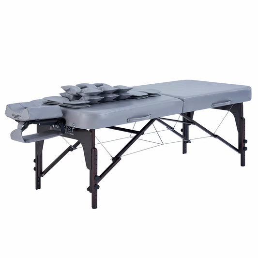 The Master Massage Bristol Airwave table set up in a clean, professional studio with visible airbag control panels and the included deluxe carry case positioned nearby.