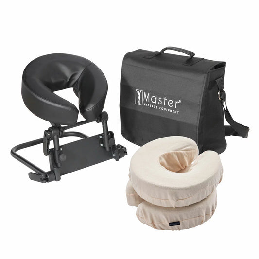 The Master Massage Mattress Top Kit set up on a bed, showing the adjustable face cradle, comfort pillow, and the aluminum frame structure.