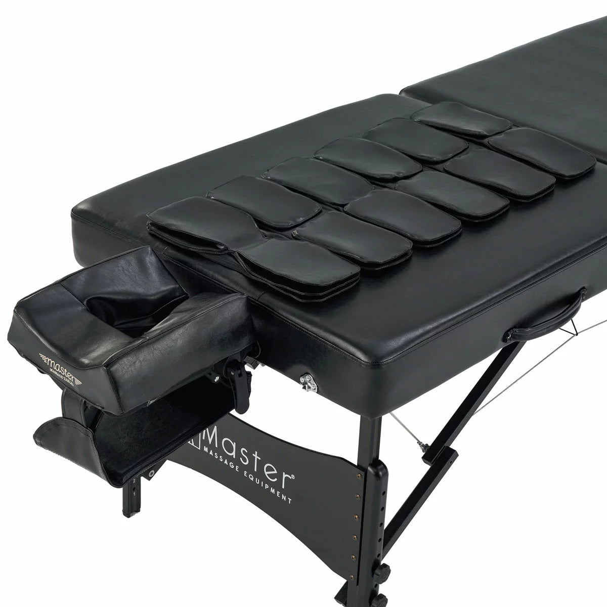 The Master Massage Monaco Airwave table showcased in a professional setting with its integrated air control console, demonstrating the sleek, ergonomic design and high-quality upholstery.