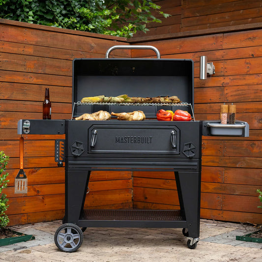 Masterbuilt 36-inch Charcoal BBQ Barbecuer on a patio with a large surface area ready for outdoor charcoal grilling.