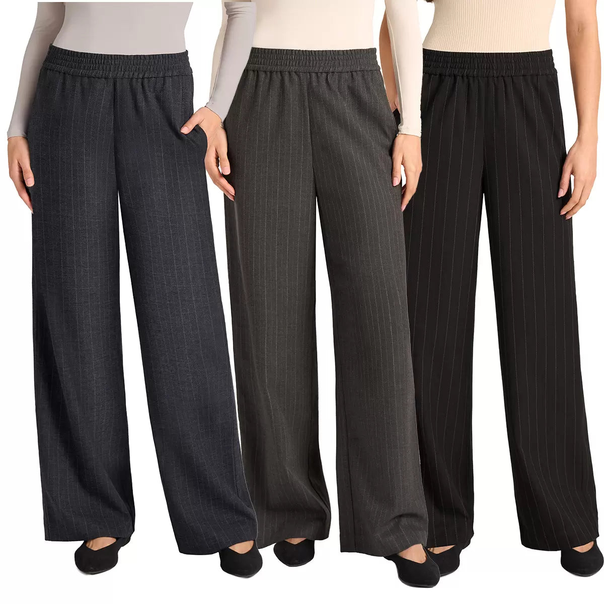 Front view of a woman wearing black Matty M high-rise pinstripe wide-leg pants paired with modern footwear in a bright studio setting.