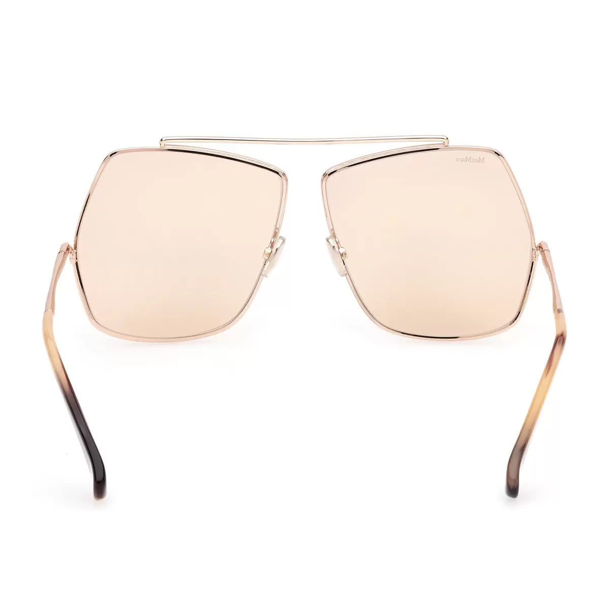 Three-quarter angle shot of MaxMara MM0006 28E women's oversized sunglasses featuring polished rose gold metal wireframes and matching rose gold lenses resting on a marble counter.
