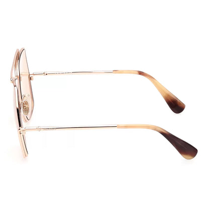 Three-quarter angle shot of MaxMara MM0006 28E women's oversized sunglasses featuring polished rose gold metal wireframes and matching rose gold lenses resting on a marble counter.