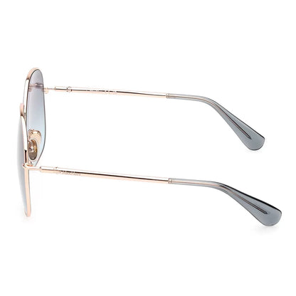 Front angle view of MaxMara MM0061 28W women's sunglasses featuring slender rose gold metal wireframes and oversized light blue lenses resting on a neutral white marble surface.