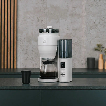 Melitta Aromafresh II Grind and Brew Pro X coffee machine with integrated grinder and glass jug .
