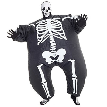 Front view of a man wearing the inflated Morph black and white skeleton MegaMorph costume standing in a brightly lit party setting.