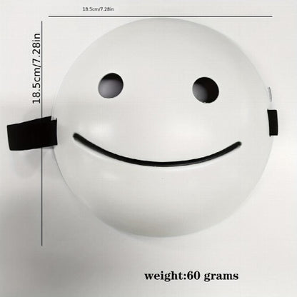Front view of a white PVC smiling Halloween mask featuring a bold black grin displayed against a clean background.