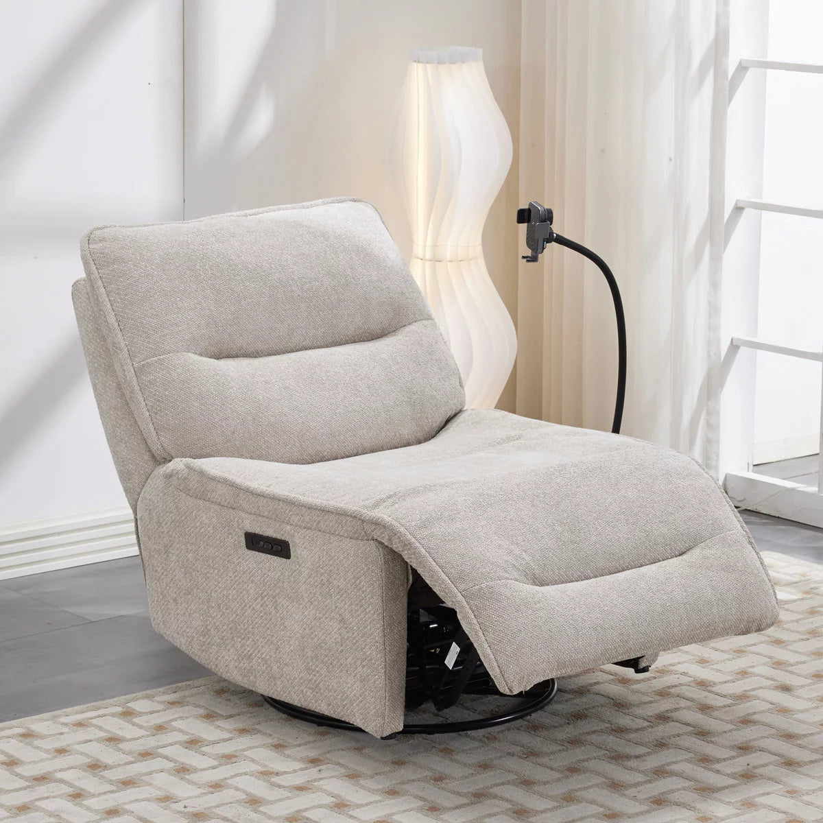 Front-facing studio view of the Meteor beige textured fabric power reclining swivel chair, highlighting its neat silhouette, adjustable integrated wireless phone charging arm, and subtle side-mounted power control buttons.