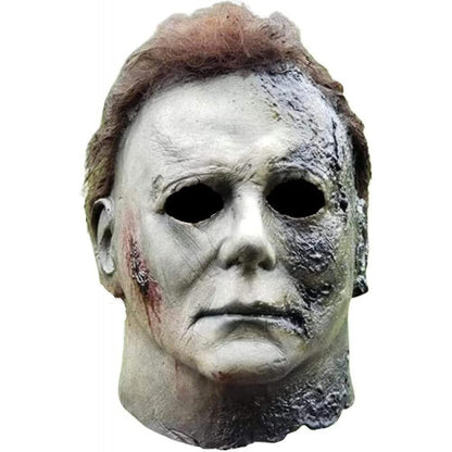 Front angle view of a realistic full face pale Michael Myers latex horror mask showcasing sculpted hair and neck details on a neutral background.