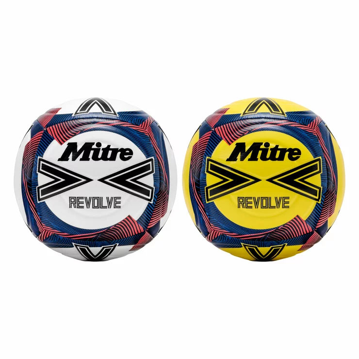 Mitre Revolve size 5 training football in high-visibility orange with a textured Vimini grip surface, sitting on a green astroturf pitch during an intense outdoor training session.