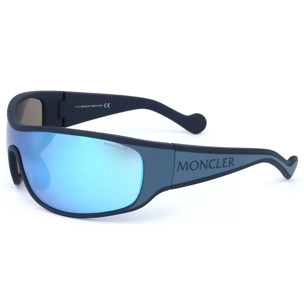 Profile view of the Moncler ML0129 92X sunglasses featuring metallic detailing, resting on a textured granite surface in bright natural light.