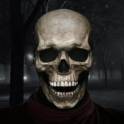 Close-up of a realistic full-head latex skull mask featuring an articulated movable jaw and intricate bone texture against a dark background.