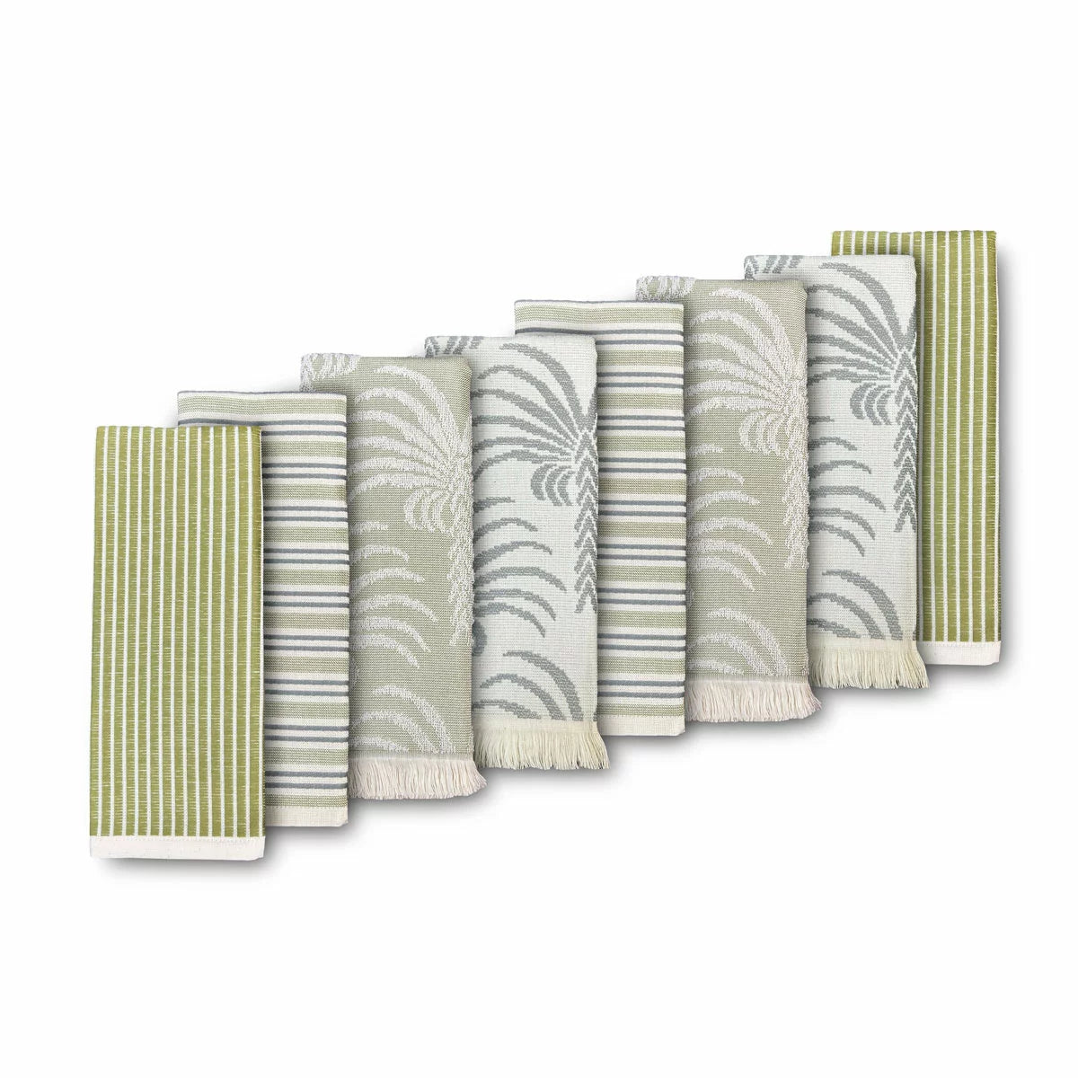 A stack of Mundo Textile kitchen towels in blue, red, neutral, and green patterns on a wooden kitchen surface.