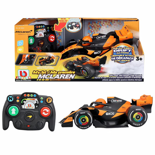 Sleek 12-inch orange and black RC Formula McLaren toy car emitting cool water vapor mist from its rear exhaust pipe on a wooden floor.