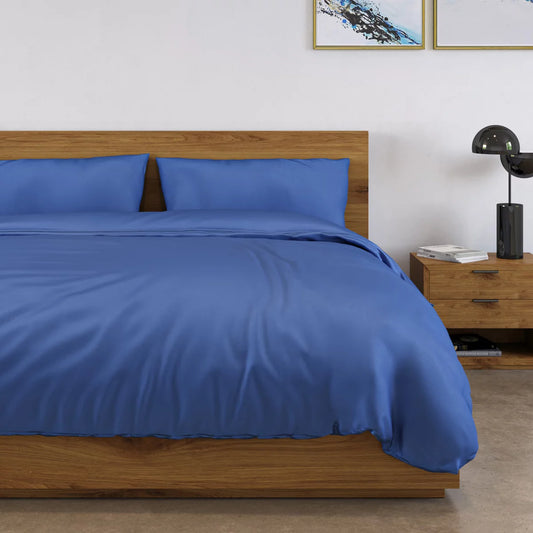 Panda 100% bamboo navy blue duvet cover set neatly dressed on a bed showing cashmere-soft texture, natural bamboo button closures, and matching pillowcases.