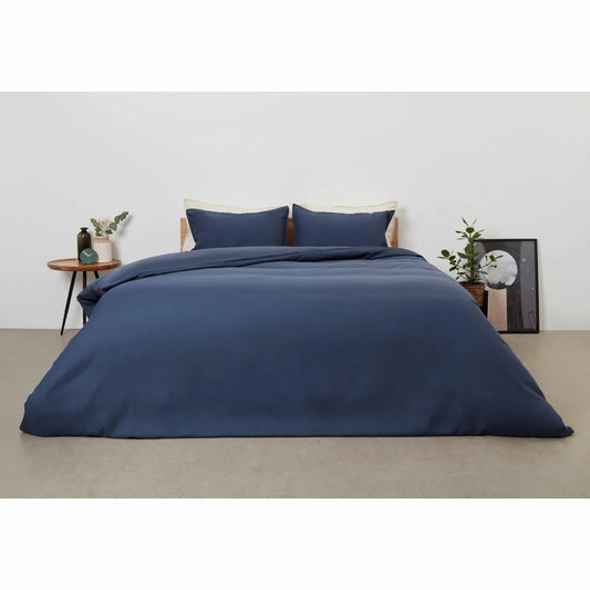 Panda Navy Bamboo and French Linen Duvet Cover Set on a bed featuring crisp matte texture, Oxford pillowcase edges, and raw bamboo buttons.