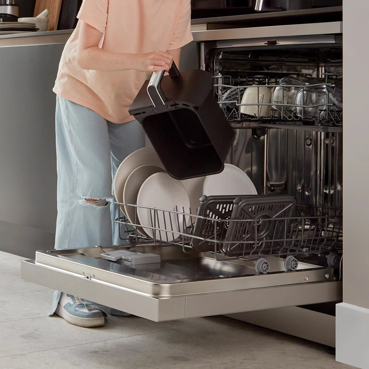 Front angle view of the black Ninja Foodi MAX AF451UK Dual Zone Air Fryer with digital touch screen displaying two pulled-out drawers and digital probe.