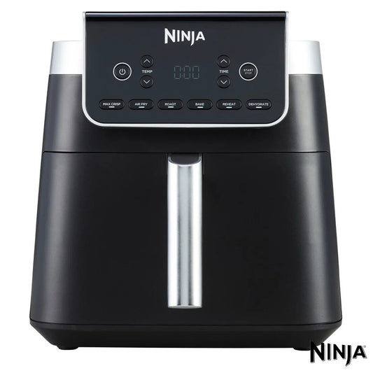 Front angle shot of the black Ninja AF180UKBRN 6.2L Air Fryer MAX Pro sitting on a modern kitchen counter with its digital control screen illuminated.