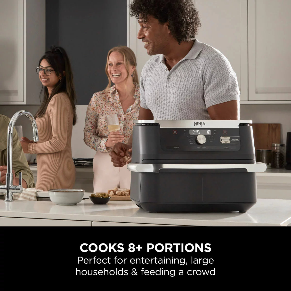 Ninja Foodi FlexDrawer 10.4L air fryer in black, shown with the dual-zone drawer pulled open to reveal the interior on a clean, modern kitchen countertop.