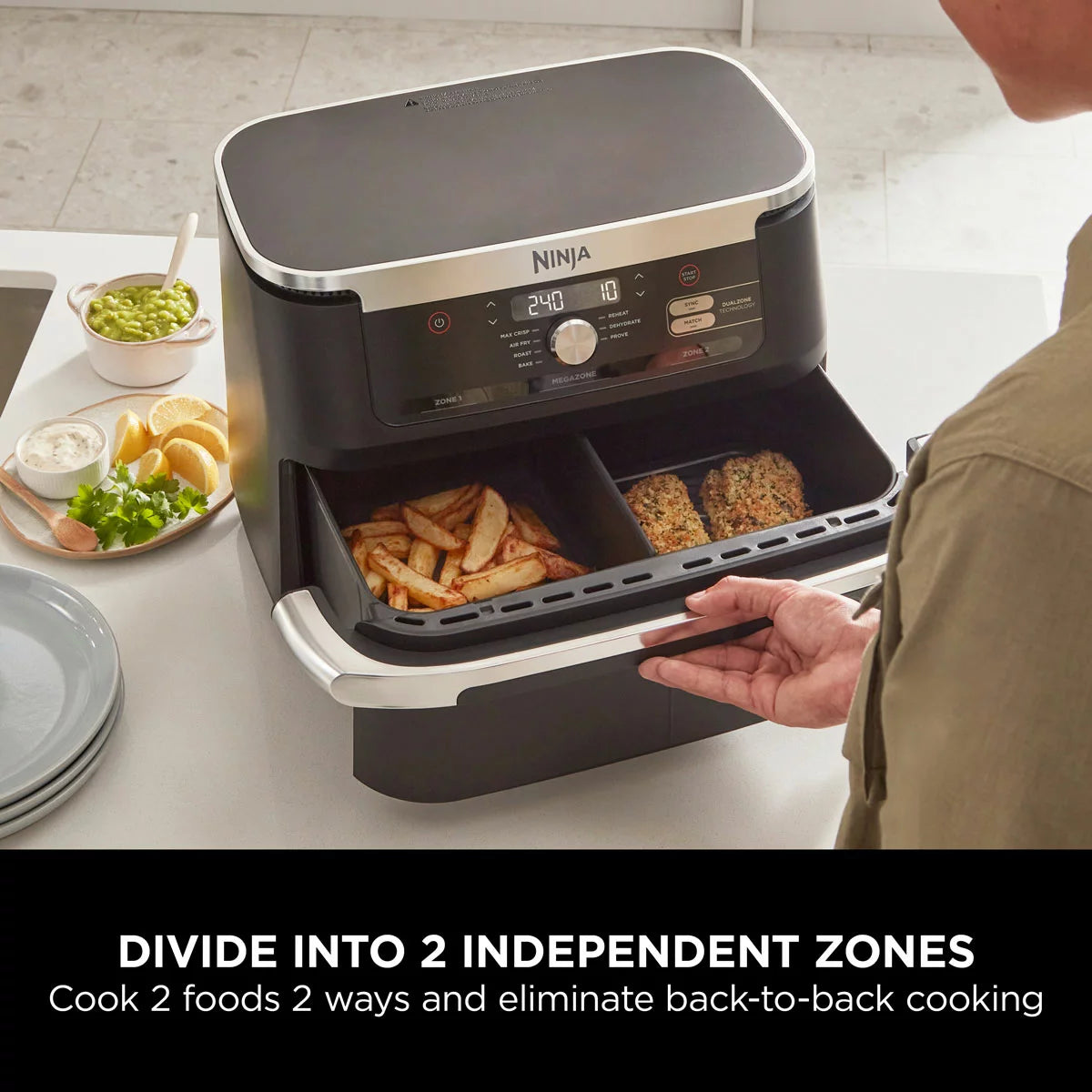 Ninja Foodi FlexDrawer 10.4L air fryer in black, shown with the dual-zone drawer pulled open to reveal the interior on a clean, modern kitchen countertop.