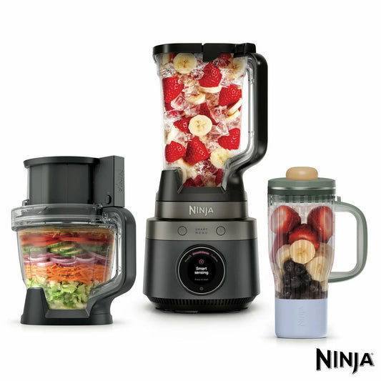 Sleek onyx black Ninja CrushBOSS 3-in-1 blender motor base shown with 2.1L jug, food processor bowl, and travel tumbler on a modern kitchen counter.