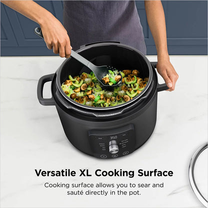 Front view of the black Ninja PC201UK HyperHeat 6L 9-in-1 pressure and rice cooker on a kitchen counter displaying its digital touch interface and sleek matte body.