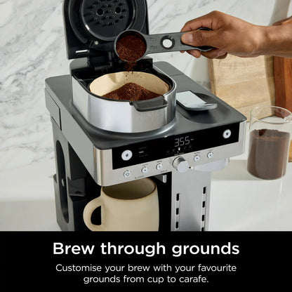 Ninja Prestige Dualbrew System CFN802UK in matte black and silver displaying the 1.8-litre glass carafe, control panel, and foldaway milk frother on a modern kitchen counter.