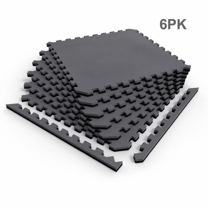 Top-angle view of six interlocking 20mm thick grey and black Norsk reversible foam tiles laid out on a concrete home gym floor.