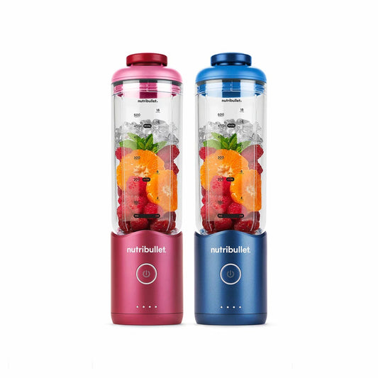 Pair of NutriBullet Dual Flex portable blenders with detachable 650ml cups and USB-C charging bases displayed on a modern kitchen counter.