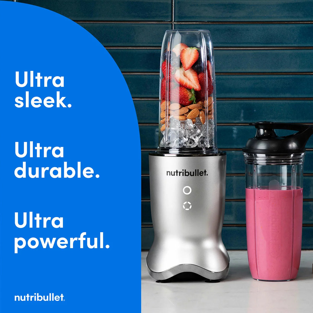 The sleek NutriBullet Ultra Deluxe blending base with a 900ml cup, stainless steel straws, and assorted lids arranged neatly on a modern kitchen surface.