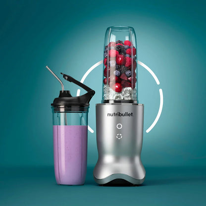 The sleek NutriBullet Ultra Deluxe blending base with a 900ml cup, stainless steel straws, and assorted lids arranged neatly on a modern kitchen surface.