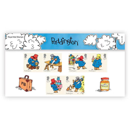 Front view of the official Royal Mail Paddington 65th anniversary framed presentation pack featuring six colorful stamps and a miniature sheet ready to hang.