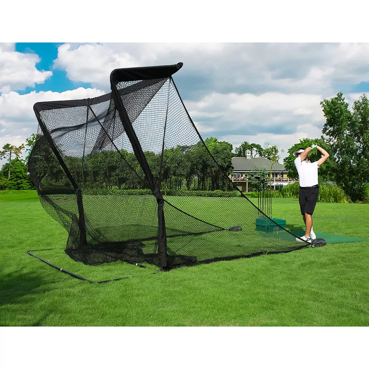 Front three-quarter view of the large black On Par Deluxe Home Golf Driving Net set up on a green garden lawn with its wide side protection wings fully extended.