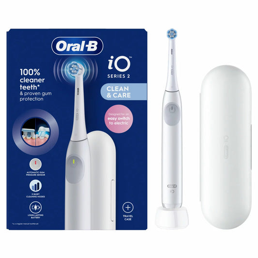 The Oral-B iO2 electric toothbrush in white, displayed with its travel case and charging base against a clean, modern bathroom backdrop.