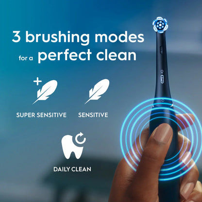 Oral-B iO 2 electric toothbrush in sleek Black, showcased with its charging base and protective travel case.