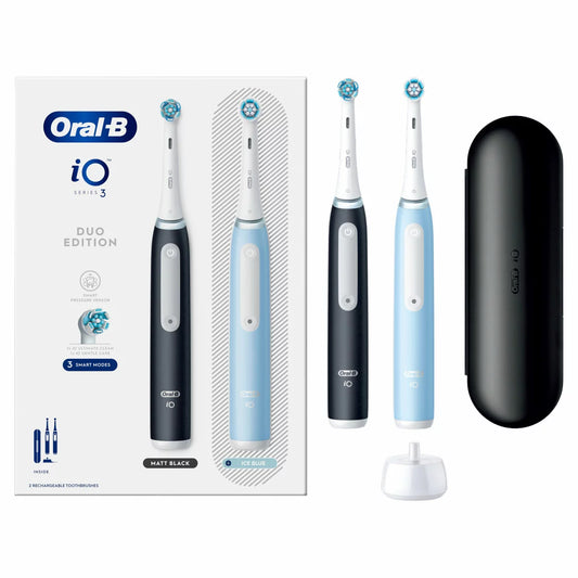 Oral-B iO 3 electric toothbrush duo pack featuring one Matt Black and one Ice Blue handle, displayed with a travel case and charging unit on a clean, modern bathroom surface.