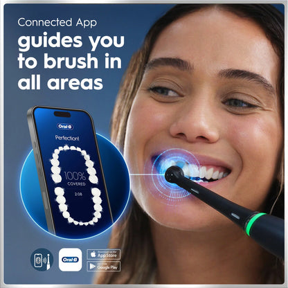 Oral-B iO 6 electric toothbrush duo pack in Black Lava and Pink Sand colors, arranged neatly on a modern vanity next to the included travel case and charging dock.