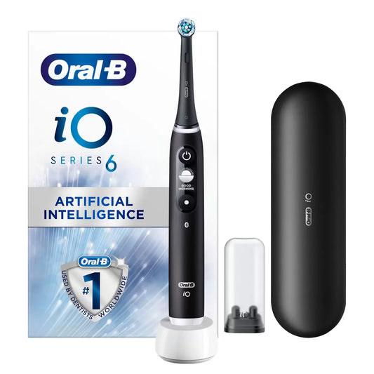 The Oral-B iO Series 6 electric toothbrush in black, displayed with its travel case and brush head against a clean, professional bathroom backdrop.