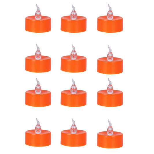 A 12-pack of orange flameless LED tea lights glowing with a warm flickering light on a festive autumn tabletop.