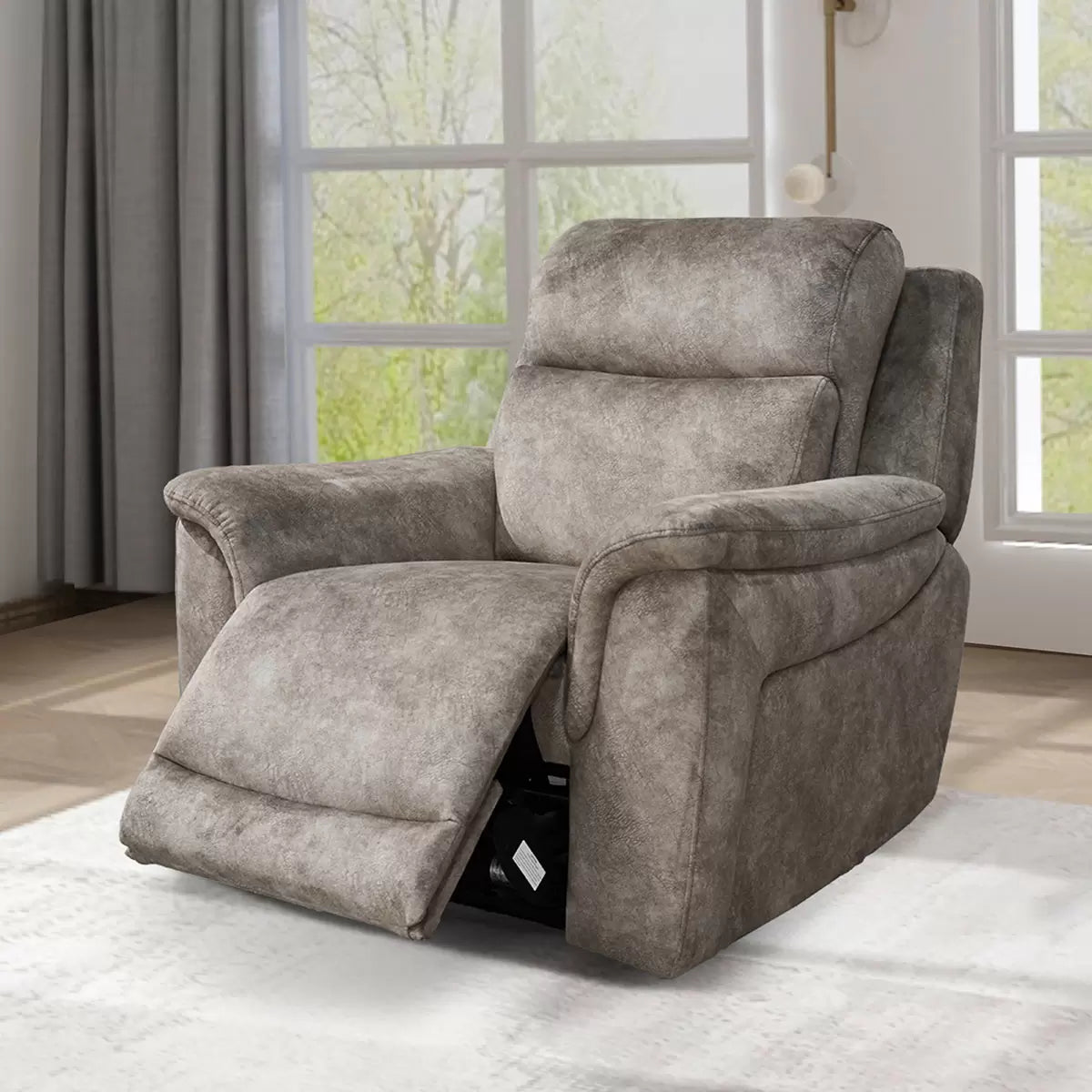 Front angle view of the Oscar grey fabric power reclining armchair in a bright living room, showcasing the textured marble-like pattern and the modern metal controls on the side.