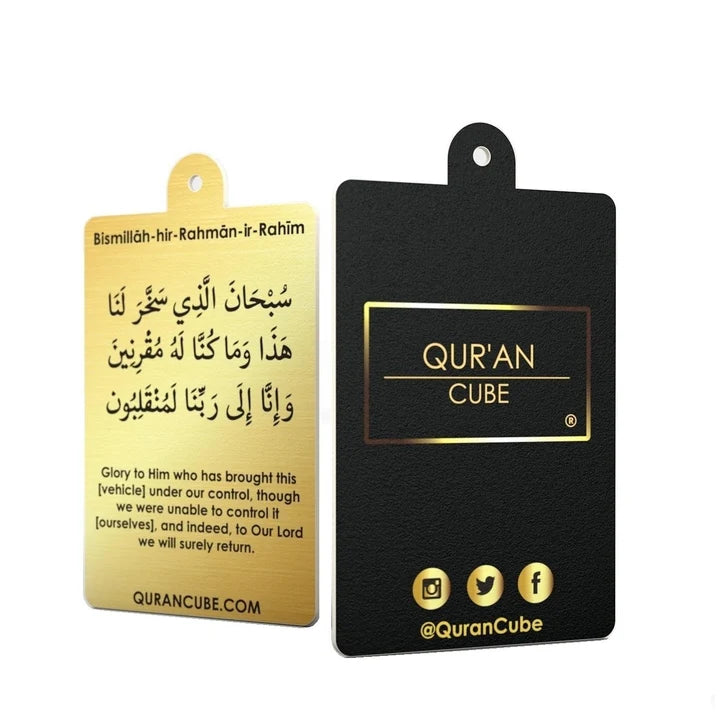 Quran Cube Oud fragrance hanging car air freshener card printed with Arabic Safar Dua script suspended against a dark car dashboard interior.