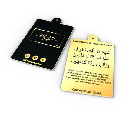 Quran Cube Oud fragrance hanging car air freshener card printed with Arabic Safar Dua script suspended against a dark car dashboard interior.