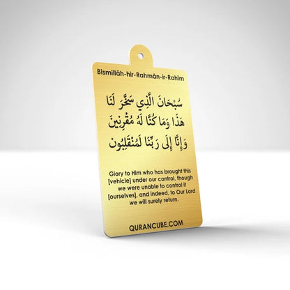 Quran Cube Oud fragrance hanging car air freshener card printed with Arabic Safar Dua script suspended against a dark car dashboard interior.
