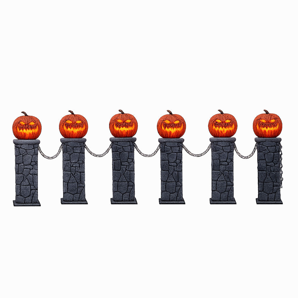A set of two light-up Halloween pumpkin fences with grey aged-stone pedestals, lit orange jack-o'-lantern tops, and black plastic connecting chains positioned on a garden lawn at night.