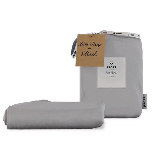 Neat fold of a charcoal grey Panda 100 percent bamboo flat sheet showing its silky sateen finish against a clean white mattress background.