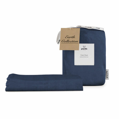 Deep navy blue Panda bamboo and French linen fitted sheet wrapped tight around the corner of a thick mattress showing its textured matte finish.