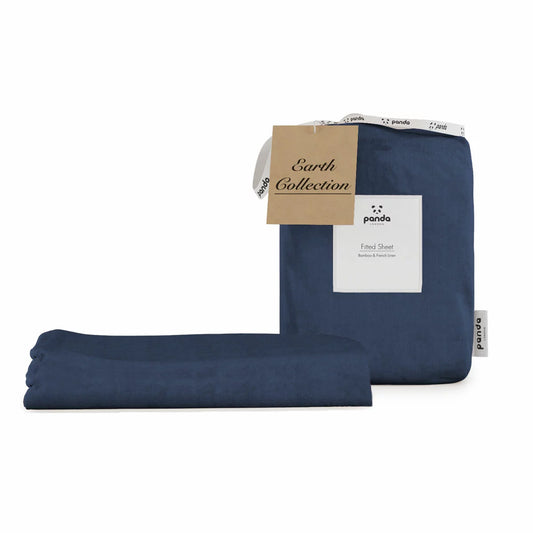 Deep navy blue Panda bamboo and French linen fitted sheet wrapped tight around the corner of a thick mattress showing its textured matte finish.