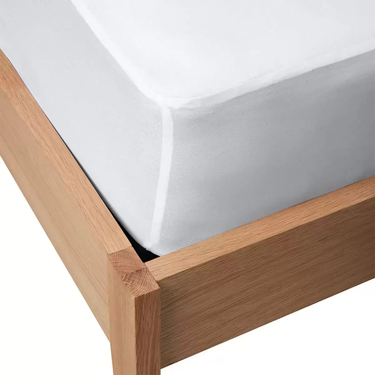 Soft white Panda Bamboo Mattress Protector showing its textured bamboo surface and deep fitted skirt fitted on a modern mattress.